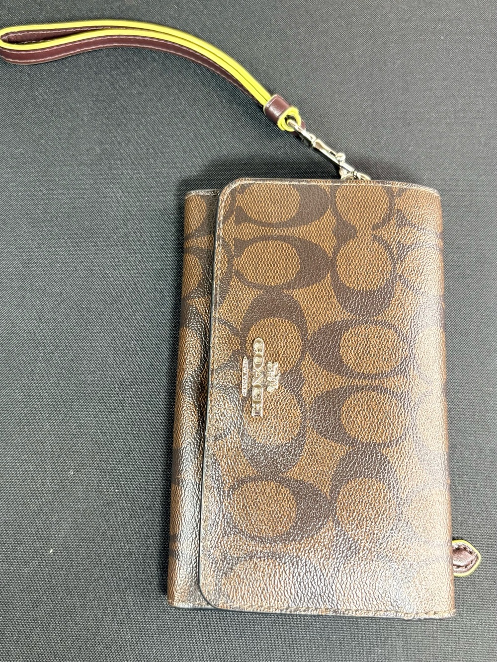 Coach Brown Signature Canvas Wristlet Phone Case with Yellow-Trim Strap